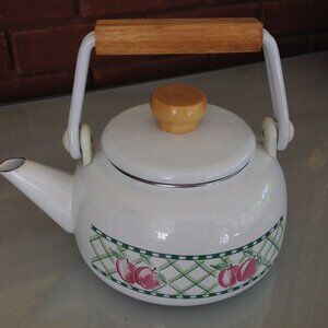 Vintages Enamel Tea Kettle Features a Decorative Design